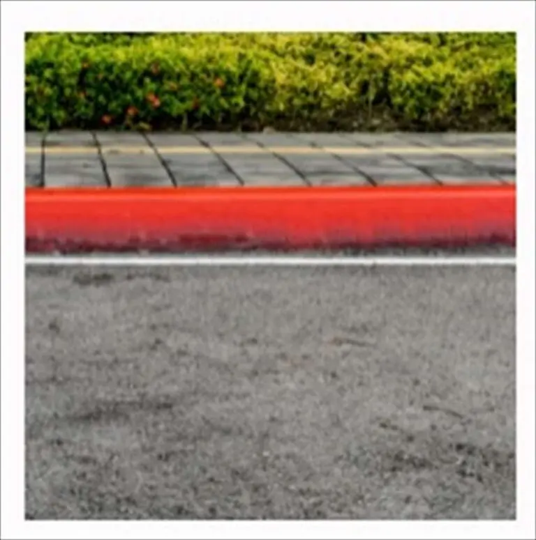 A red- colored curb marking